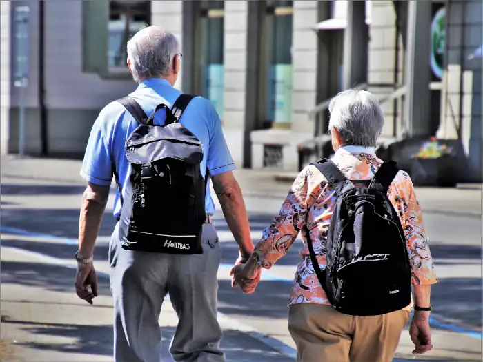 couple hand in hand, walking