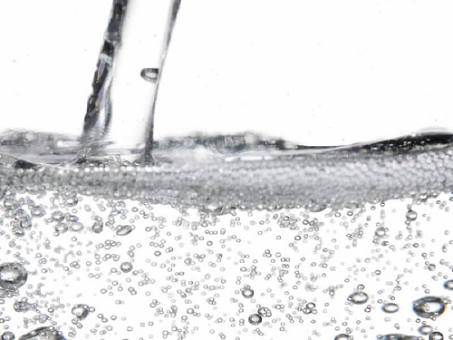 bubbles in a glass of sparkling water
