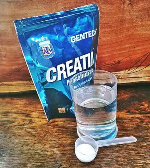 glass, spoon, creatine and packet