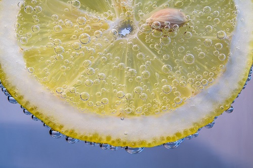 Zesty slice of lemon in water